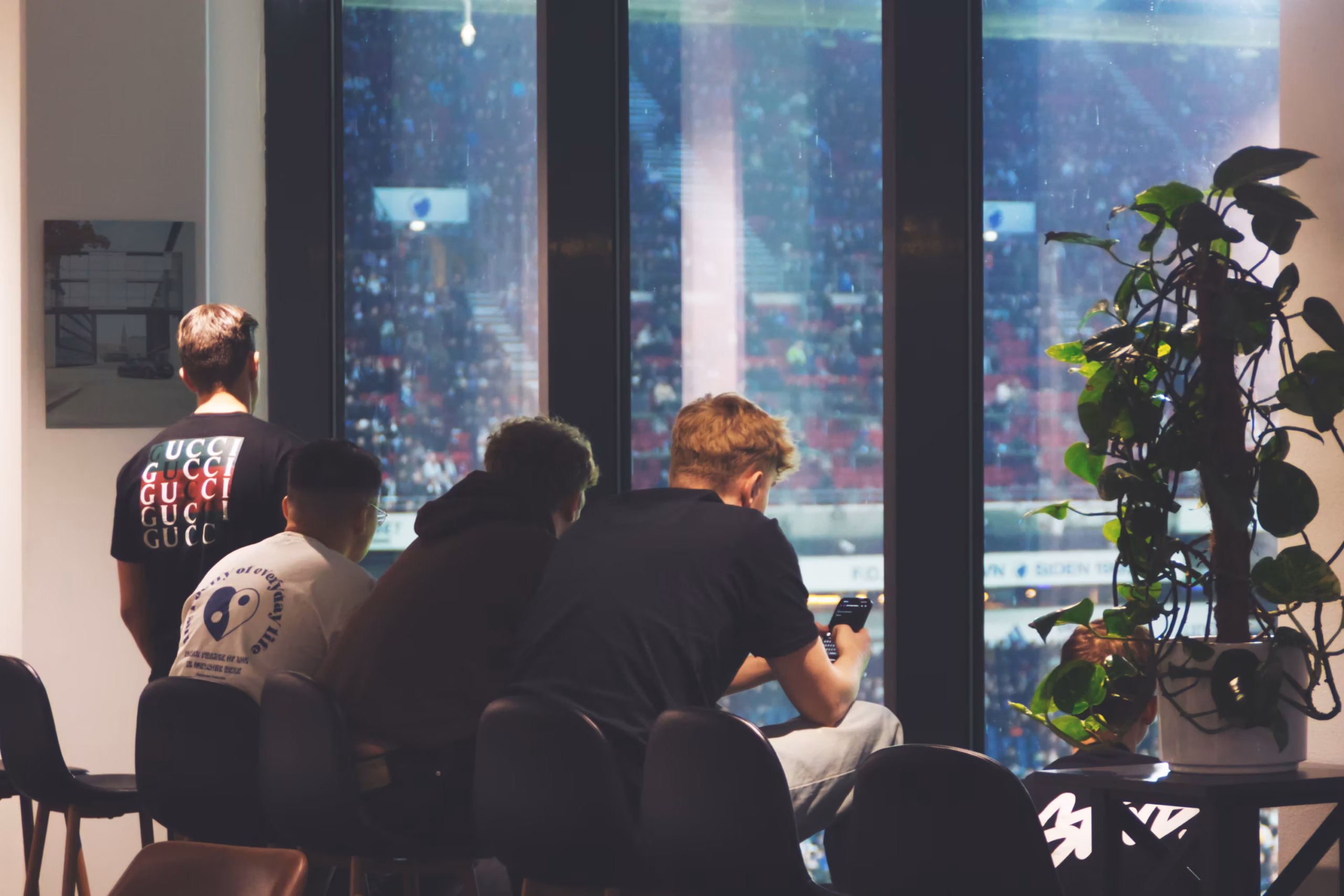 Image of 4 guys watching a soccer game in Legendary Gaming Group event area